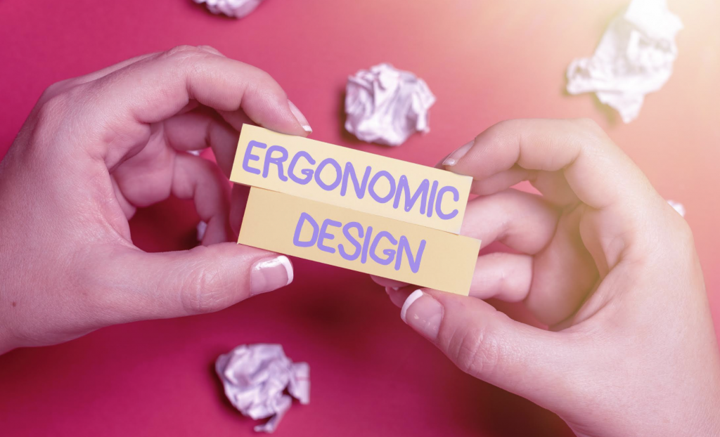 Two hands hold a small sign that advertise ergonomic design.