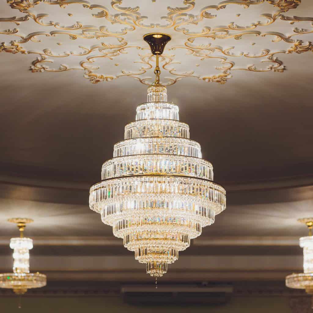 Chandeliers hang proudly in a formal dining room.