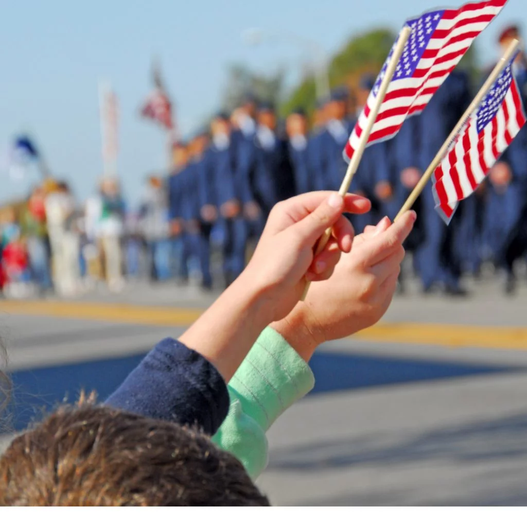A young patriot waves the American flag.