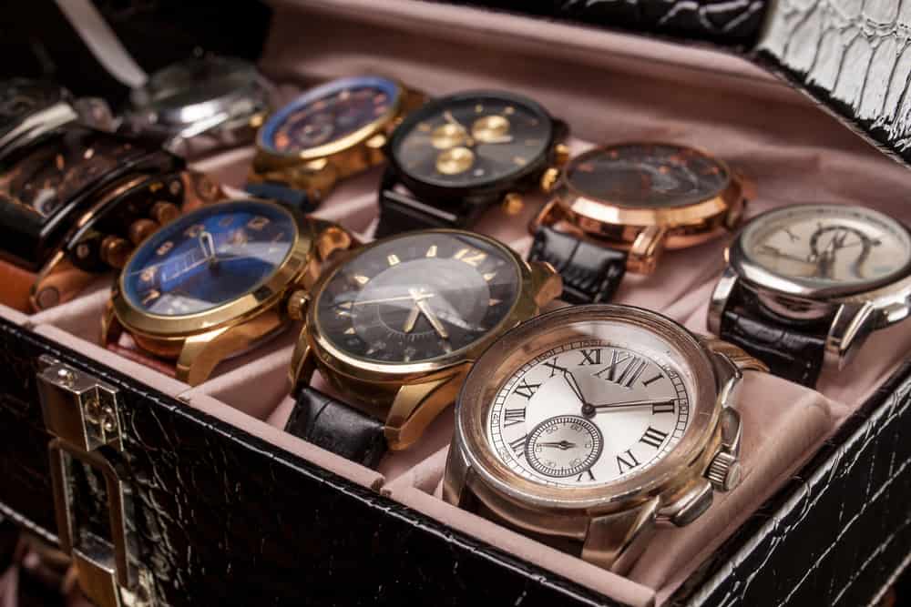 A watch display cushion shows off an assortment of unique watches.