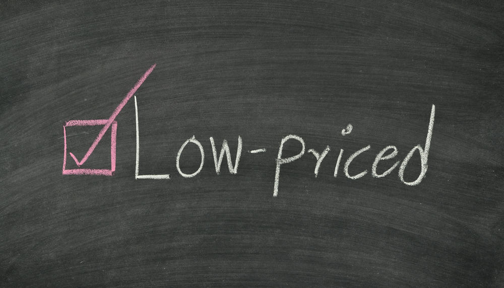 A chalboard with the words 'low-priced' written on it.